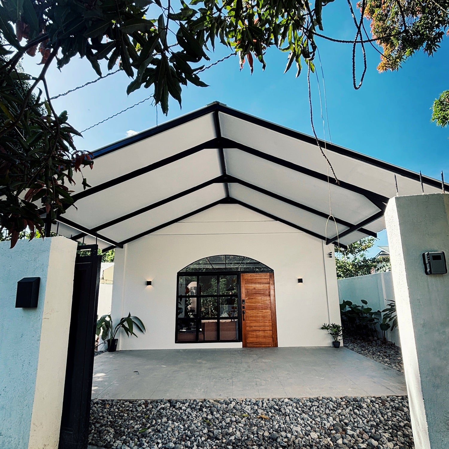 Modern house with a covered entrance and blue sky Converted chapel dumaguete